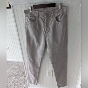 American eagle tapered leg jeans in light gray.
